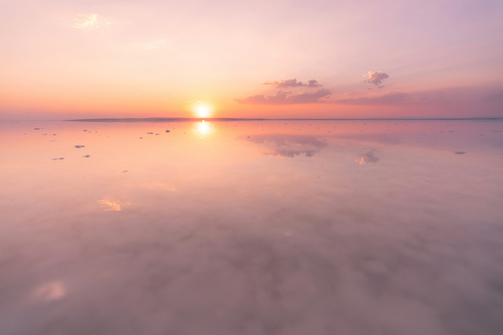 a sunset over a body of water